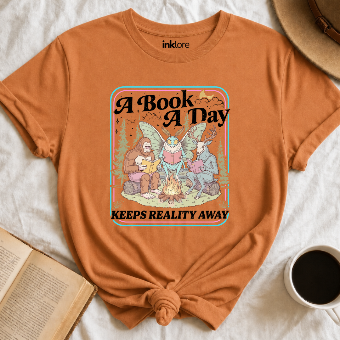"A Book A Day Keeps Reality Away" T-Shirt | Cryptid Campfire Book Lover Graphic Tee & Fantasy Reader Shirt