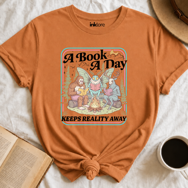 "A Book A Day Keeps Reality Away" T-Shirt | Cryptid Campfire Book Lover Graphic Tee & Fantasy Reader Shirt
